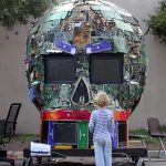 Kid faces giant robot head. Photo by Erik Charlton.