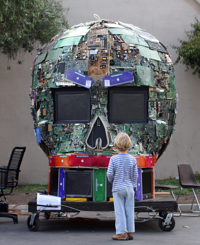 Kid faces giant robot head. Photo by Erik Charlton.